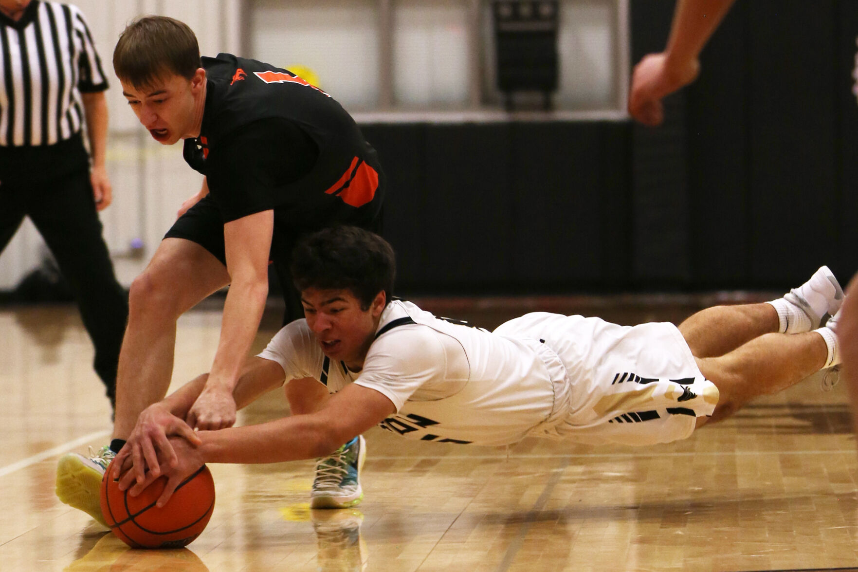 Eli Patterson dives across the court to steal